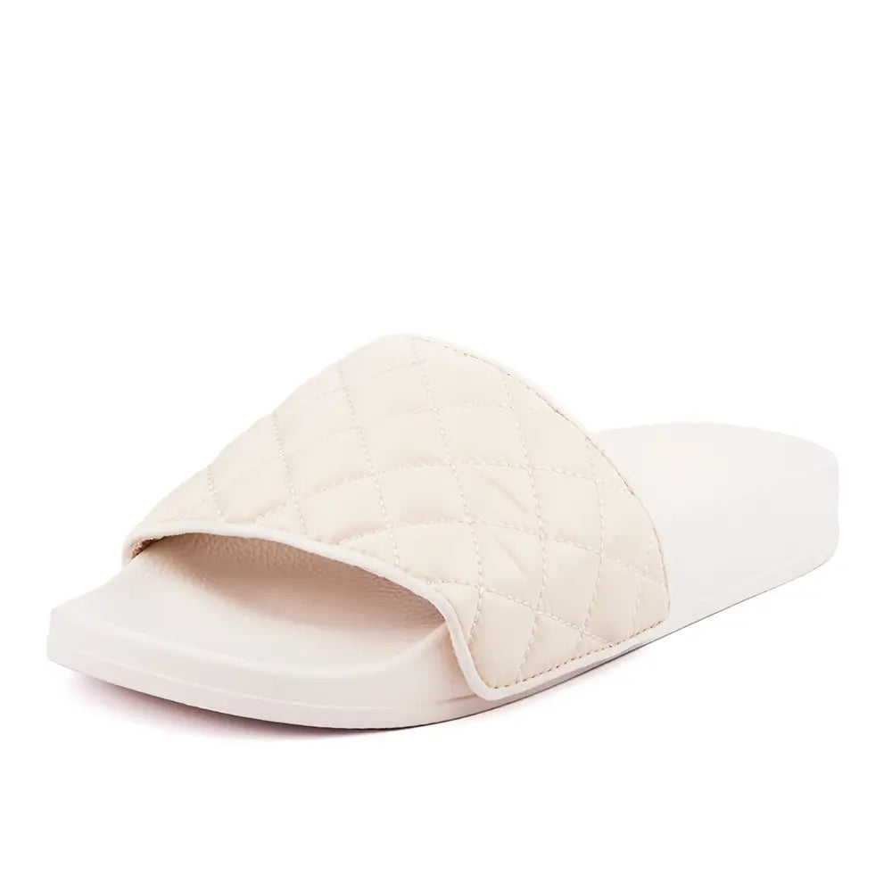 Australian designer white slides with upper in white quilted fabric.