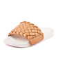 White slides with braided faux leather upper in camel colour.