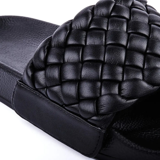 Black slides with braided faux leather upper.