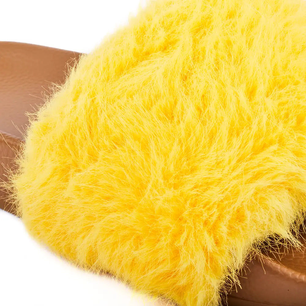 Camel slides with fluffy yellow fur upper.