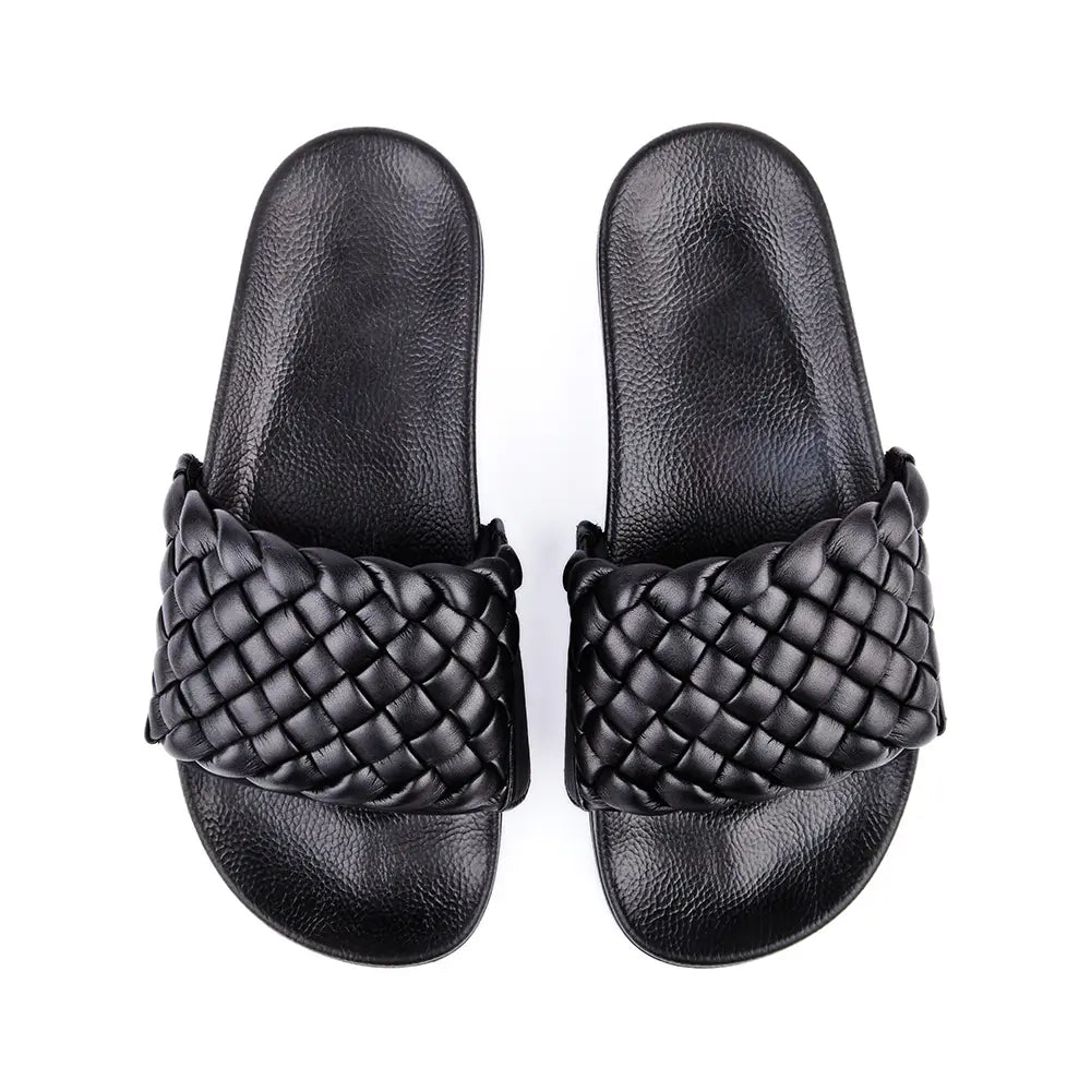 Black slides with black braided faux leather upper.