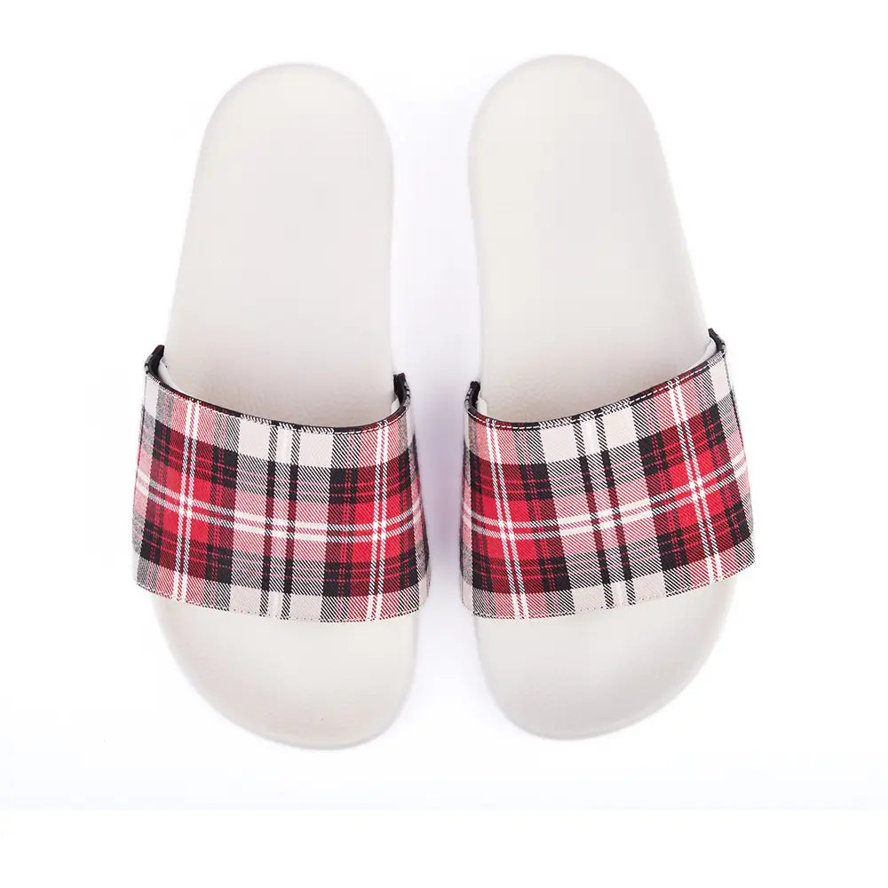 Australian designer white slides with upper in chequered patterned canvas in red, ivory, white, brown and black.