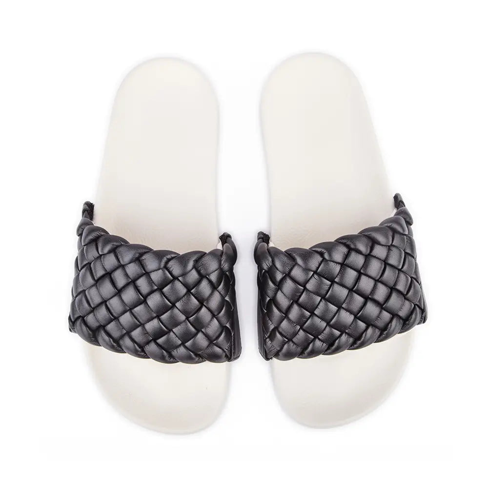 White slides with black braided faux leather upper.